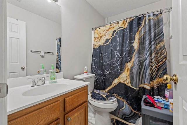 bathroom featuring a textured ceiling, toilet, vanity, and a shower with curtain