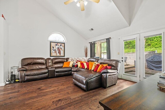 living area featuring high vaulted ceiling, a ceiling fan, wood finished floors, and visible vents