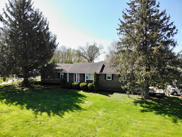 ranch-style house with a front yard
