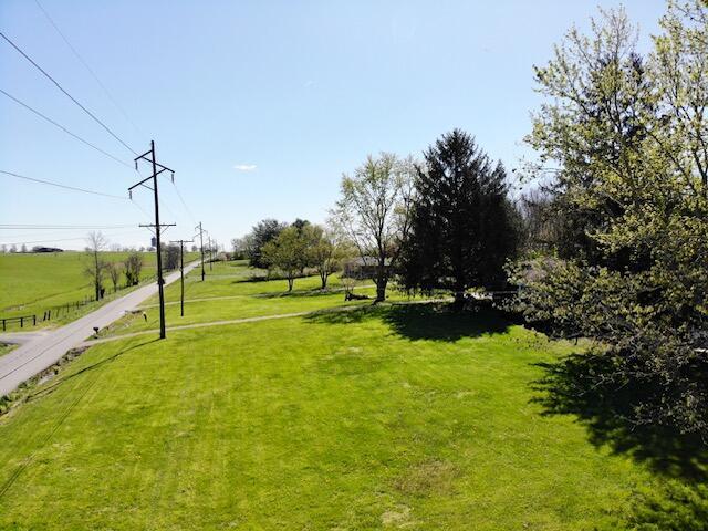 view of home's community with a yard