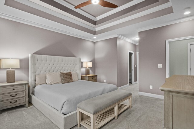 bedroom featuring light carpet, baseboards, recessed lighting, crown molding, and a raised ceiling