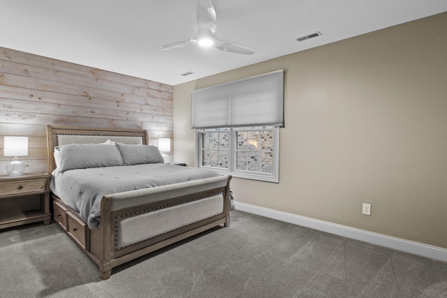 carpeted bedroom featuring baseboards, visible vents, and ceiling fan