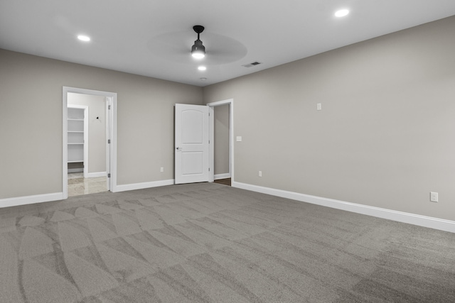 interior space with a ceiling fan, carpet, baseboards, visible vents, and recessed lighting