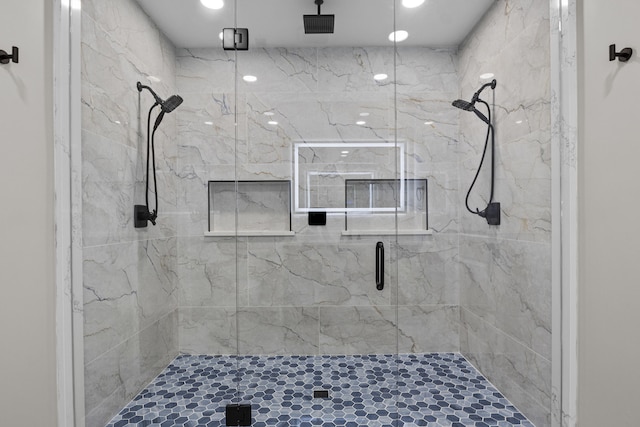 full bathroom with a marble finish shower