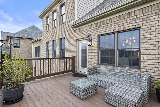 wooden terrace featuring outdoor lounge area
