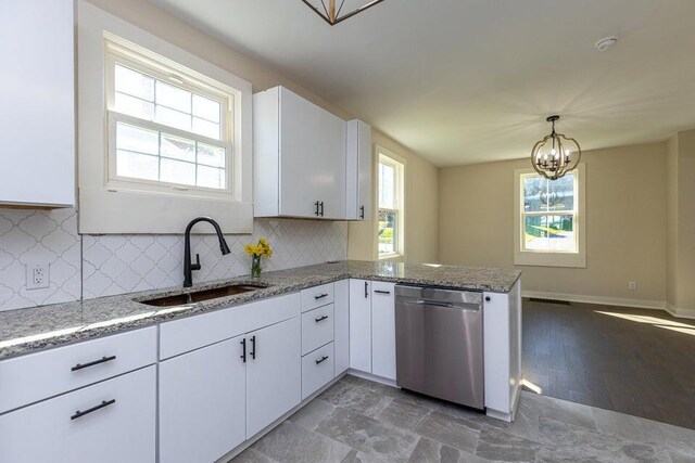 401 E Main St, Danville, KY 40422 - kitchen featuring a chandelier, white cabinets, dishwasher, a sink, and a peninsula