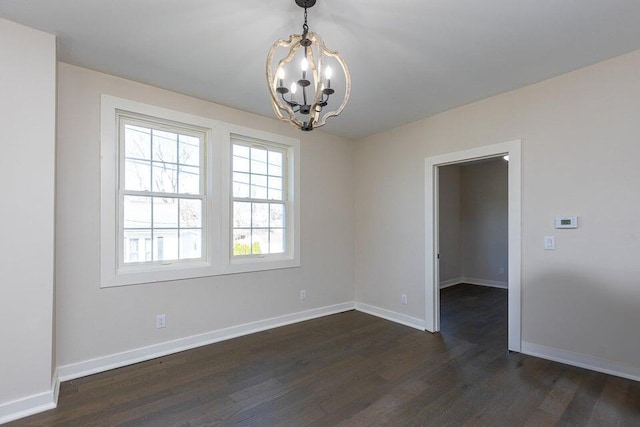 401 E Main St, Danville, KY 40422 - spare room with dark wood-style floors, baseboards, and a notable chandelier