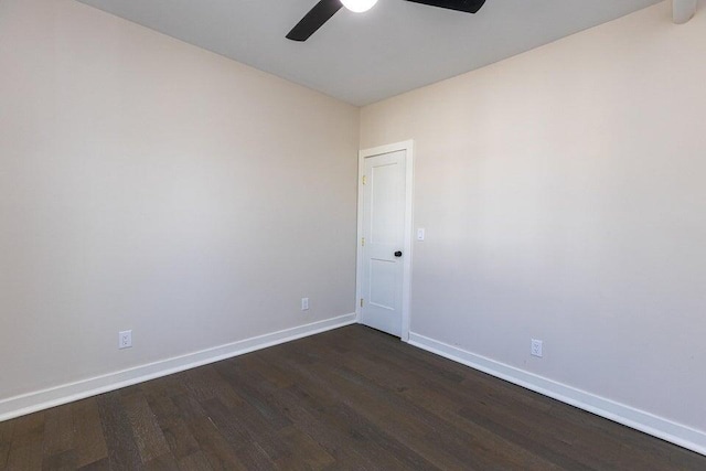 401 E Main St, Danville, KY 40422 - spare room featuring baseboards, a ceiling fan, and dark wood-type flooring