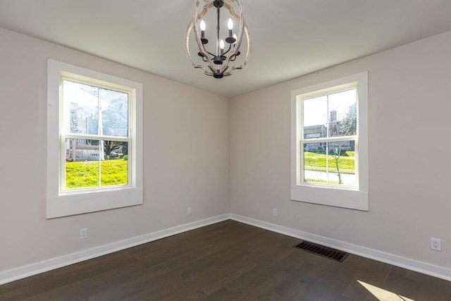 401 E Main St, Danville, KY 40422 - unfurnished room with a chandelier, visible vents, dark wood-type flooring, and baseboards