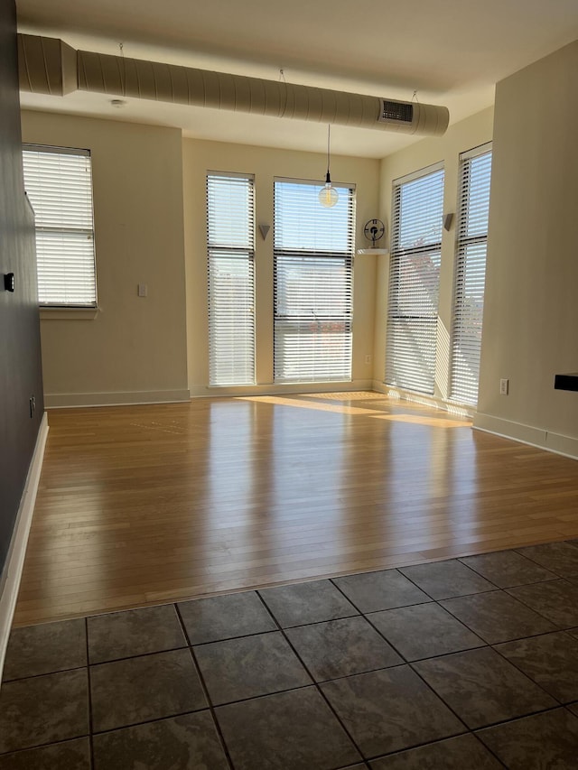 650 S Mill St Unit 218, Lexington, KY 40508 - empty room with dark wood-type flooring, plenty of natural light, and baseboards