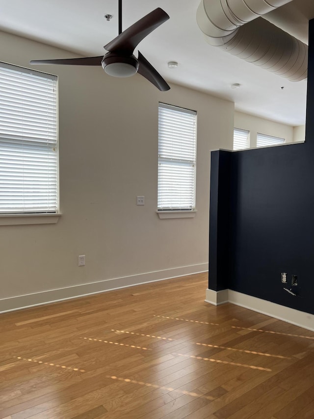 650 S Mill St Unit 218, Lexington, KY 40508 - empty room featuring wood-type flooring, baseboards, and fire sprinkler in ceiling