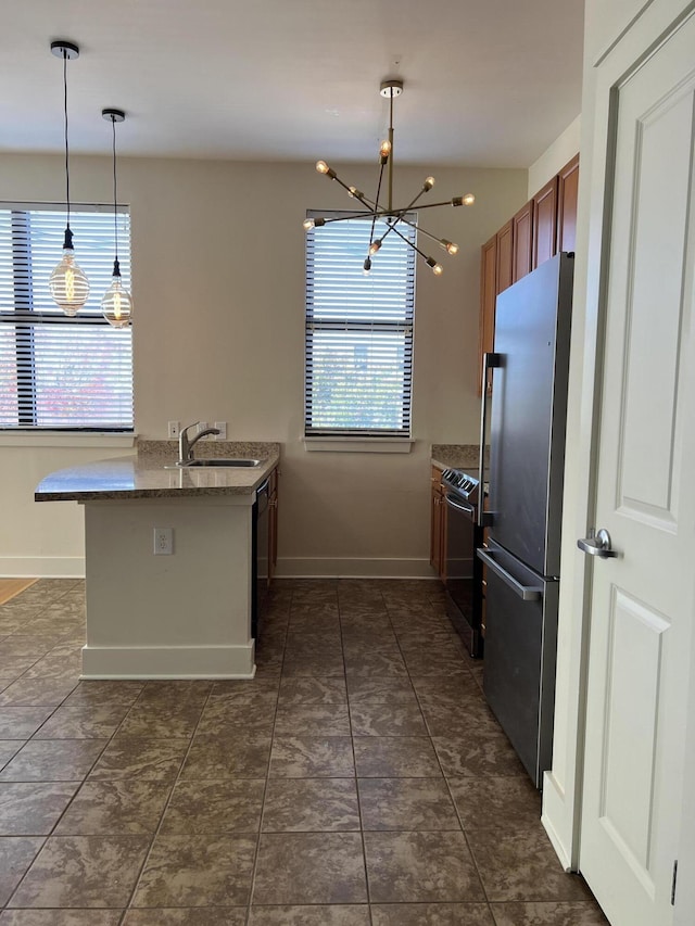 650 S Mill St Unit 218, Lexington, KY 40508 - kitchen featuring appliances with stainless steel finishes, plenty of natural light, a chandelier, and a sink