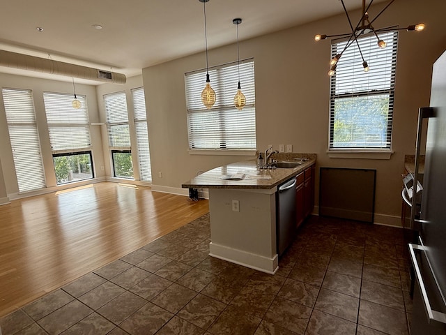 650 S Mill St Unit 218, Lexington, KY 40508 - kitchen with stainless steel appliances, a peninsula, healthy amount of natural light, and baseboards