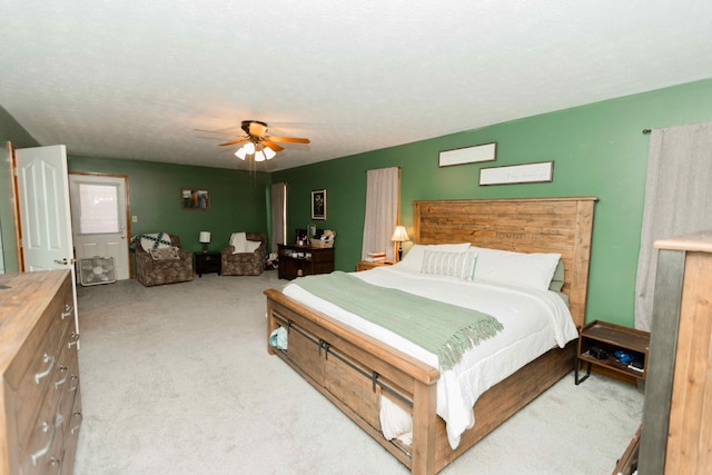 carpeted bedroom featuring a ceiling fan