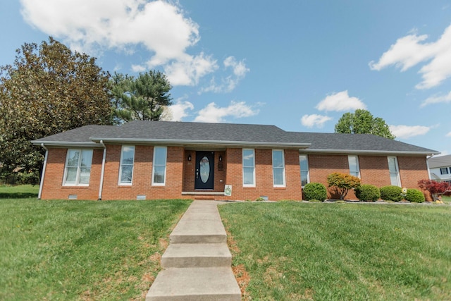 ranch-style house featuring brick siding and a front yard