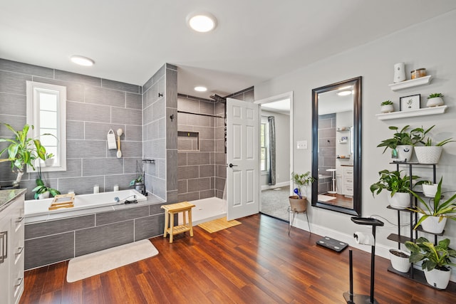 100 Lair St, Mount Vernon, KY 40456 - bathroom featuring a walk in shower, a garden tub, vanity, and wood finished floors