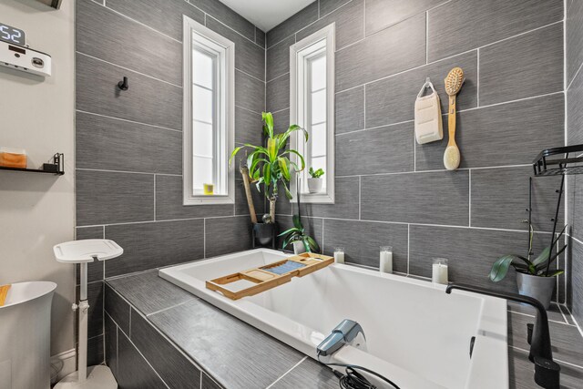 100 Lair St, Mount Vernon, KY 40456 - bathroom featuring healthy amount of natural light, a bath, and tile walls