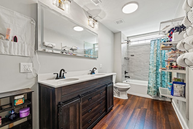 100 Lair St, Mount Vernon, KY 40456 - bathroom with wood-type flooring, shower / bath combo with shower curtain, double vanity, and toilet