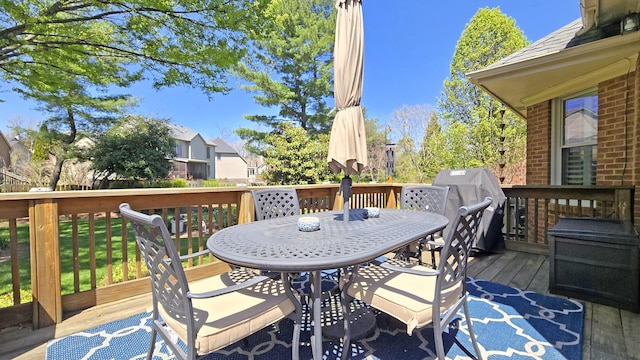 wooden deck with outdoor dining space