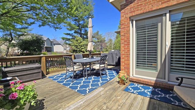 wooden deck with outdoor dining space