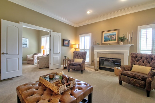 carpeted living room with crown molding, baseboards, and a premium fireplace