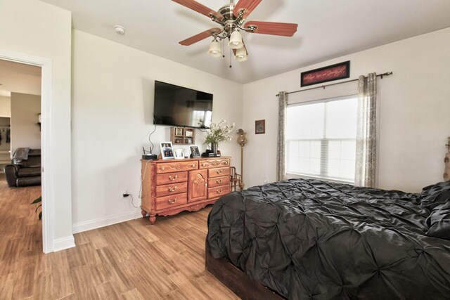 1105 Locust Fork Rd, Stamping Ground, KY 40379 - bedroom with light wood-style flooring, baseboards, and a ceiling fan