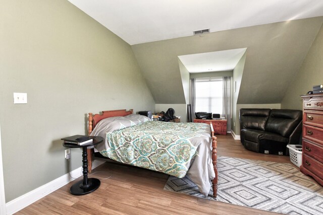 1105 Locust Fork Rd, Stamping Ground, KY 40379 - bedroom featuring wood finished floors, baseboards, vaulted ceiling, and visible vents