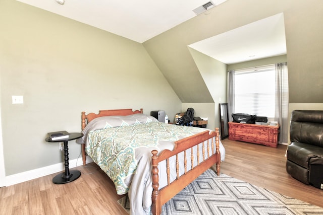 1105 Locust Fork Rd, Stamping Ground, KY 40379 - bedroom featuring lofted ceiling, wood finished floors, visible vents, and baseboards