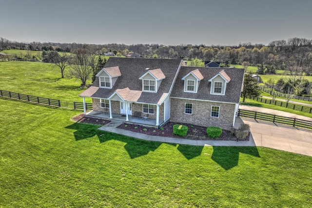 1105 Locust Fork Rd, Stamping Ground, KY 40379 - cape cod-style house with roof with shingles, fence, stone siding, and a front yard
