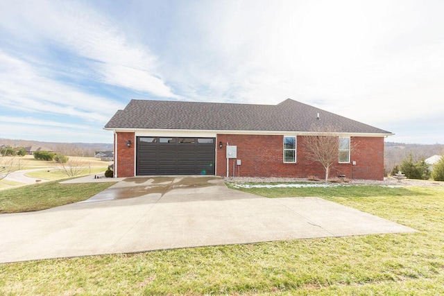 view of home's exterior with an attached garage, a lawn, driveway, and brick siding