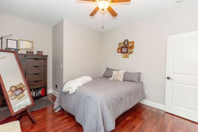 bedroom with baseboards, a ceiling fan, and wood finished floors
