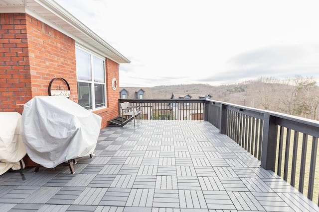 view of patio featuring a grill and a deck
