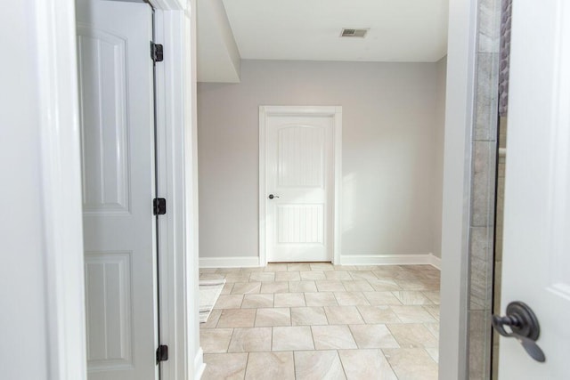 corridor with visible vents and baseboards
