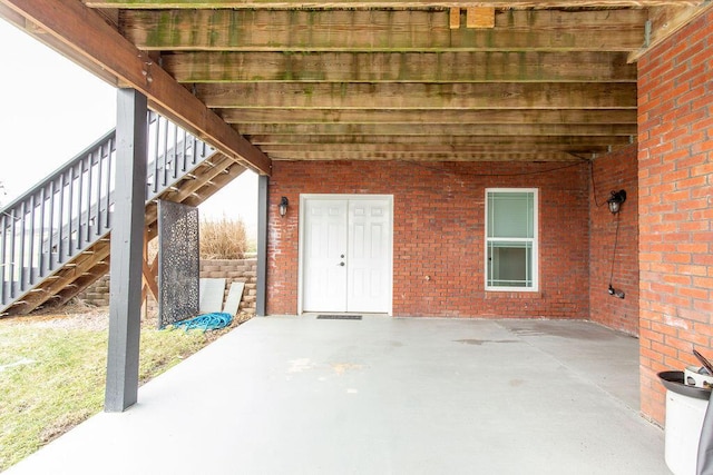 view of patio / terrace featuring stairs