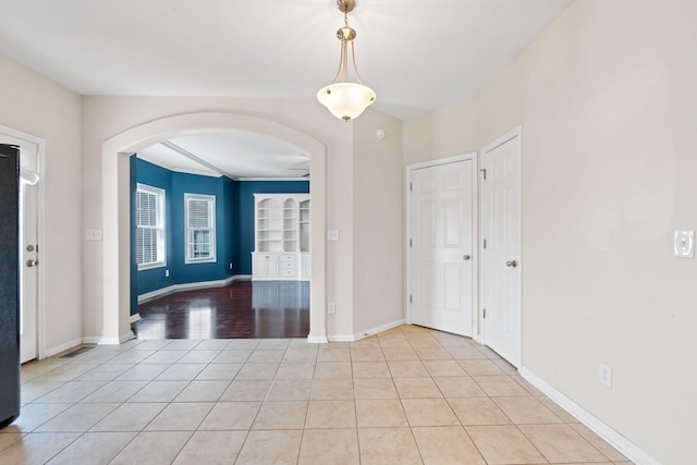 325 Long Branch Ln, Lexington, KY 40511 - entryway featuring arched walkways, light tile patterned floors, and baseboards