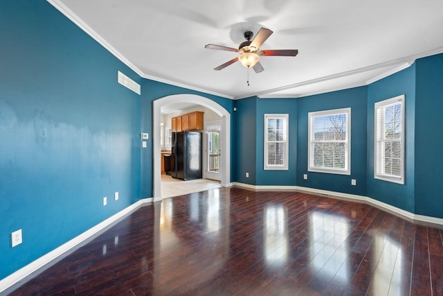 325 Long Branch Ln, Lexington, KY 40511 - spare room with ceiling fan, arched walkways, crown molding, baseboards, and wood finished floors