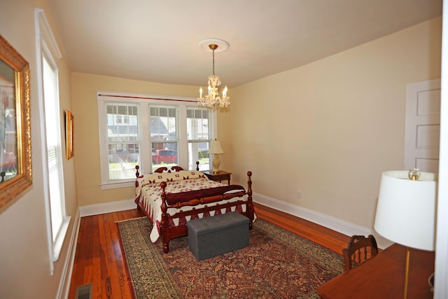 113 Olde Potomac Ave, Winchester, KY 40391 - bedroom featuring visible vents, baseboards, dark wood-style flooring, and an inviting chandelier
