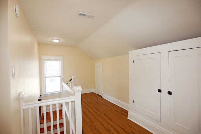 113 Olde Potomac Ave, Winchester, KY 40391 - hallway featuring vaulted ceiling, baseboards, visible vents, an upstairs landing, and wood finished floors