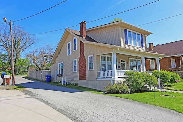113 Olde Potomac Ave, Winchester, KY 40391 - view of front of house featuring a porch, a front lawn, a chimney, and fence