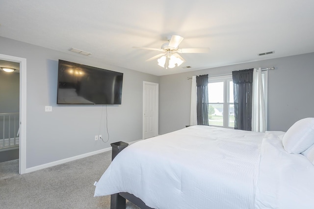 carpeted bedroom featuring ceiling fan, baseboards, and visible vents
