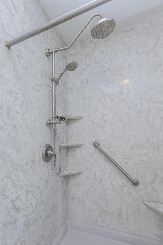 interior details featuring a shower