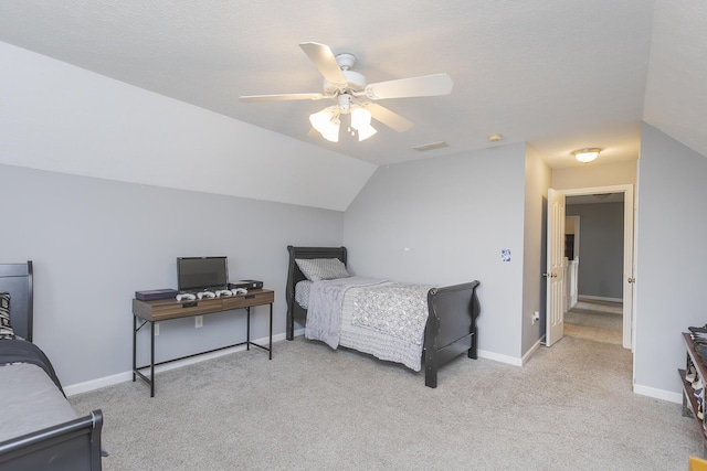 bedroom with vaulted ceiling, ceiling fan, light colored carpet, baseboards, and visible vents