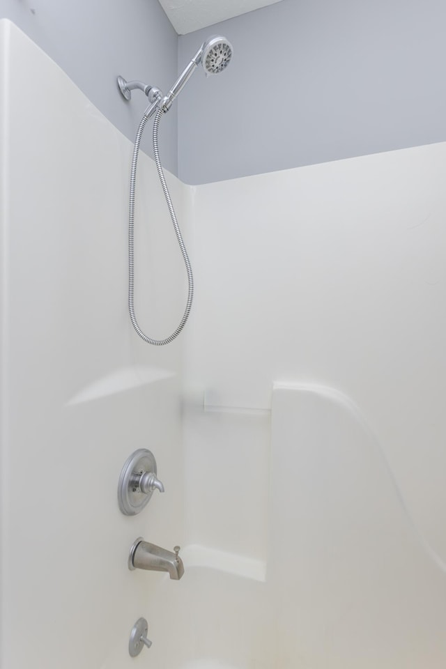 room details featuring bathtub / shower combination