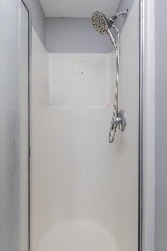 room details featuring a shower stall