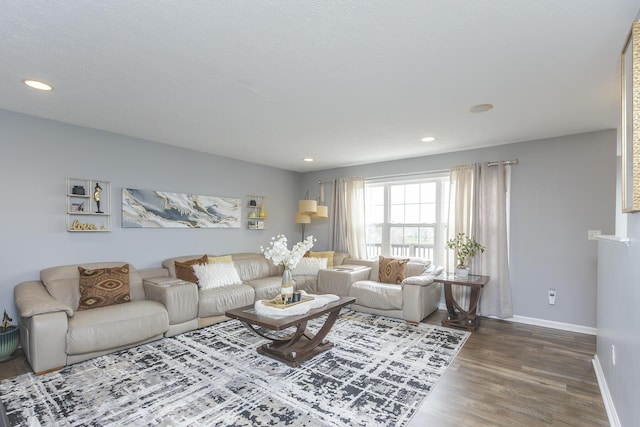 living area featuring recessed lighting, wood finished floors, and baseboards