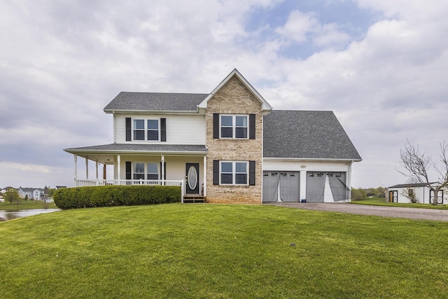 view of front facade featuring an attached garage, driveway, a porch, brick siding, and a front yard