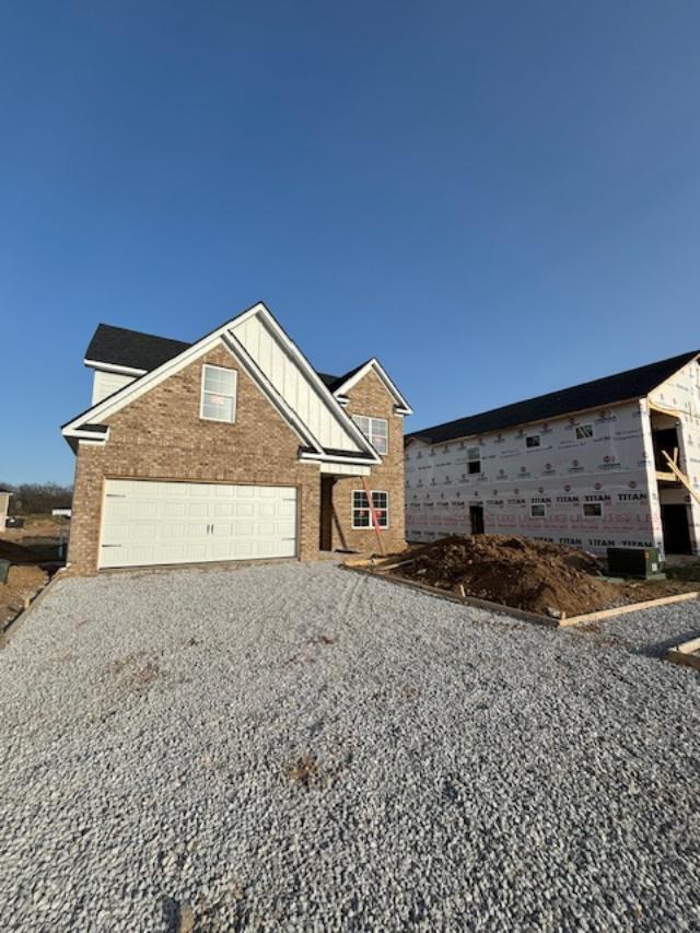 151 Village Park Dr, Georgetown, KY 40324 - view of front facade with brick siding, an attached garage, and driveway