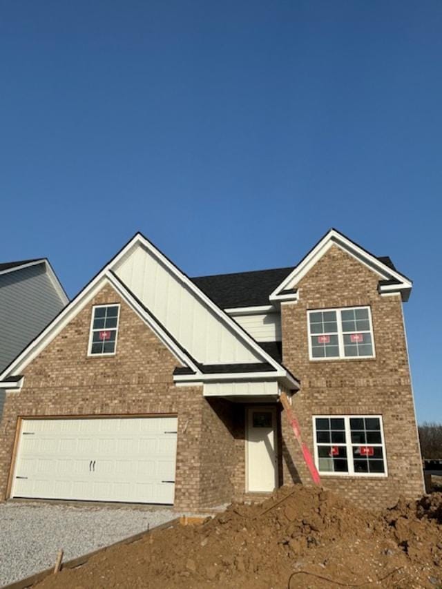 151 Village Park Dr, Georgetown, KY 40324 - view of front of house featuring brick siding, driveway, board and batten siding, and a garage