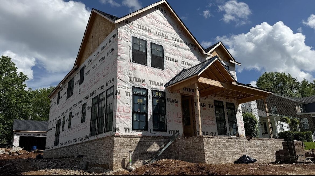 property under construction with stone siding