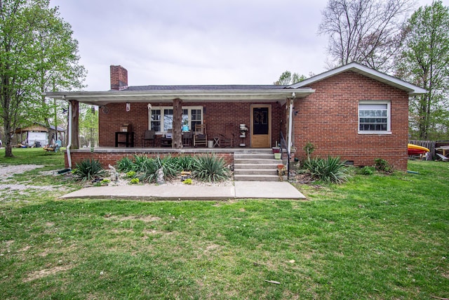 20 Hemlock Subdivision Rd, Williamsburg, KY 40769 - rear view of property featuring brick siding, a chimney, a yard, and covered porch